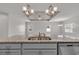 Close-up of a kitchen island with granite countertop, stainless steel sink and faucet with view to living space at 346 High Falls Dr., Conway, SC 29526