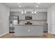 Modern kitchen boasts stainless steel appliances, granite countertops, and a functional island at 346 High Falls Dr., Conway, SC 29526