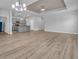 Open-concept living area boasts wood-look flooring, recessed lighting, with seamless transition to kitchen at 346 High Falls Dr., Conway, SC 29526