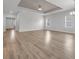 Bright living room with wood-look flooring, ample space, and modern ceiling fan at 346 High Falls Dr., Conway, SC 29526