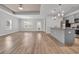 Expansive living area featuring stylish wood floors, recessed ceilings and open concept design at 346 High Falls Dr., Conway, SC 29526