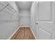 Empty walk-in closet with wire shelving and wood-look flooring at 346 High Falls Dr., Conway, SC 29526