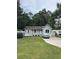 Charming single-story home featuring a well-maintained lawn and a classic covered porch at 3534 Gordon Dr., Myrtle Beach, SC 29579
