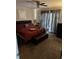 Cozy bedroom with carpet floors and plenty of natural light from the sliding glass door at 3534 Gordon Dr., Myrtle Beach, SC 29579