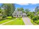 Aerial shot of a house with manicured lawn, mature trees, and a long driveway at 401 Harmon Park Blvd., Marion, SC 29571