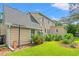 Backyard view showing a well-maintained lawn and the exterior of the home at 401 Harmon Park Blvd., Marion, SC 29571