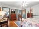 Comfortable bedroom with hardwood floors, a four-poster bed, and classic decor at 401 Harmon Park Blvd., Marion, SC 29571