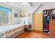 Bright bedroom featuring hardwood floors, a twin bed, and a ceiling fan at 401 Harmon Park Blvd., Marion, SC 29571