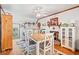 Inviting breakfast nook with hardwood floors, white shiplap walls, fireplace, and built-in cabinets at 401 Harmon Park Blvd., Marion, SC 29571