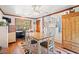 Cozy breakfast nook featuring hardwood floors, ceiling fan, built-in desk area, natural light, and eat-in dining at 401 Harmon Park Blvd., Marion, SC 29571