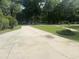 Long concrete driveway leading to the home with green lawn at 401 Harmon Park Blvd., Marion, SC 29571