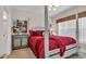 Comfortable main bedroom featuring a four-poster bed, soft lighting, and stylish decor at 4142 Hibiscus Dr. # 102, Little River, SC 29566