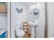 Cozy bathroom with a pedestal sink, ample storage, and an adjacent walk-in shower at 4201 N Ocean Blvd. # Ocean View, Myrtle Beach, SC 29572