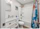 Bright bathroom with a walk-in shower and a stylish, ocean-themed shower curtain at 4201 N Ocean Blvd. # Ocean View, Myrtle Beach, SC 29572