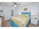 Comfortable bedroom featuring a ceiling fan and bright bedding with a beachy theme at 4201 N Ocean Blvd. # Ocean View, Myrtle Beach, SC 29572