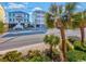 Charming two-story beach house with a welcoming staircase and picturesque palm trees at 4201 N Ocean Blvd. # Ocean View, Myrtle Beach, SC 29572