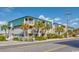 Coastal condo building featuring palm trees and balconies under a bright blue sky at 4201 N Ocean Blvd. # Ocean View, Myrtle Beach, SC 29572