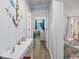 Bright hallway with beach-themed decor leading to bedrooms and living area at 4201 N Ocean Blvd. # Ocean View, Myrtle Beach, SC 29572
