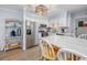 Bright kitchen with stainless appliances, white cabinets, and dining area at 4201 N Ocean Blvd. # Ocean View, Myrtle Beach, SC 29572
