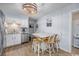 Well-lit kitchen with stainless steel appliances and a charming dining space at 4201 N Ocean Blvd. # Ocean View, Myrtle Beach, SC 29572
