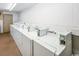 Convenient on-site laundry room with multiple washing machines for residents at 4201 N Ocean Blvd. # Ocean View, Myrtle Beach, SC 29572
