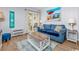 Comfortable living room with beach artwork and a sliding glass door to the patio at 4201 N Ocean Blvd. # Ocean View, Myrtle Beach, SC 29572