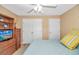 A cozy bedroom with light walls, built-in storage, and a ceiling fan at 4366 Rivergate Ln. # 306, Little River, SC 29566