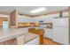 Bright kitchen features white cabinets, stainless steel appliances, and a movable island at 4366 Rivergate Ln. # 306, Little River, SC 29566