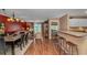 Open floor plan with kitchen bar, living area with sliding glass doors, and bedroom entrance at 4366 Rivergate Ln. # 306, Little River, SC 29566
