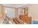 Bright living room with neutral paint, a dresser, and a window at 4366 Rivergate Ln. # 306, Little River, SC 29566