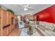Inviting living room with plush seating, a glass coffee table, and a red accent wall at 4366 Rivergate Ln. # 306, Little River, SC 29566