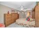 A spacious main bedroom with a large bed, wooden dressers, and neutral tones at 4366 Rivergate Ln. # 306, Little River, SC 29566