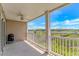 Open air patio with ceiling fan and view of marshlands and waterway at 4366 Rivergate Ln. # 306, Little River, SC 29566