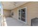 Spacious patio with ceiling fan, grill, and outdoor seating perfect for relaxing at 4366 Rivergate Ln. # 306, Little River, SC 29566