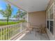 Enjoy outdoor dining on this covered patio overlooking lush greenery and water at 4366 Rivergate Ln. # 306, Little River, SC 29566