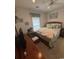 Comfortable bedroom with neutral tones and a well-lit window at 448 Mahogany Dr. # 201, Murrells Inlet, SC 29576