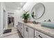 Bright bathroom featuring double vanity with granite countertops and round mirrors, and a walk-in closet at 4486 Bethel Rd., Aynor, SC 29511