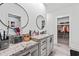 A bathroom featuring double sinks, granite counters, and a view into the shower and walk-in closet at 4486 Bethel Rd., Aynor, SC 29511
