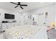A bedroom with a ceiling fan, a TV, a queen-size bed, and an ensuite bathroom at 4486 Bethel Rd., Aynor, SC 29511