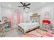 Cozy bedroom with a ceiling fan, a decorative bed frame, and lots of natural light at 4486 Bethel Rd., Aynor, SC 29511