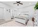 Bedroom featuring a ceiling fan, a queen-size bed, and an ensuite bathroom at 4486 Bethel Rd., Aynor, SC 29511