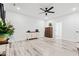 Open bedroom with hardwood floors, neutral walls, ceiling fan and spacious closet at 4486 Bethel Rd., Aynor, SC 29511