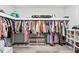 Spacious walk-in closet featuring ample hanging space, shelving, and a bench at 4486 Bethel Rd., Aynor, SC 29511