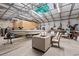 Large metal garage with a boat, a dining table set, and plenty of storage space at 4486 Bethel Rd., Aynor, SC 29511