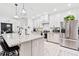 The kitchen features a spacious island with seating, stainless appliances, and modern lighting fixtures at 4486 Bethel Rd., Aynor, SC 29511