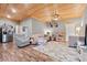 Cozy living room featuring a striking wood ceiling, neutral walls, and comfortable seating arrangement at 4486 Bethel Rd., Aynor, SC 29511