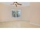 Bright, spacious bedroom with a large window and light-colored walls at 4552 River Rd., Little River, SC 29566