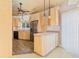 Kitchen with wood cabinets, stainless steel refrigerator, and light countertops, blending functionality with style at 4552 River Rd., Little River, SC 29566