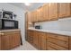 Functional kitchenette with ample cabinet space, white countertops, and modern appliances at 4552 River Rd., Little River, SC 29566