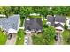 A lovely home featuring mature trees, dark roofing, and a well-manicured lawn, all enclosed by a classic white fence at 462 Wallingford Circle, Myrtle Beach, SC 29588